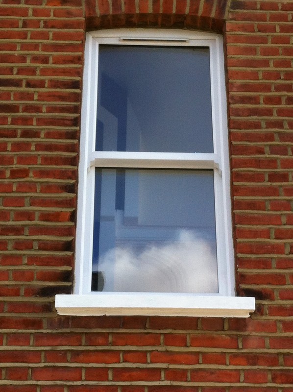 uPVC sash window on Victorian red brick house in Feltham